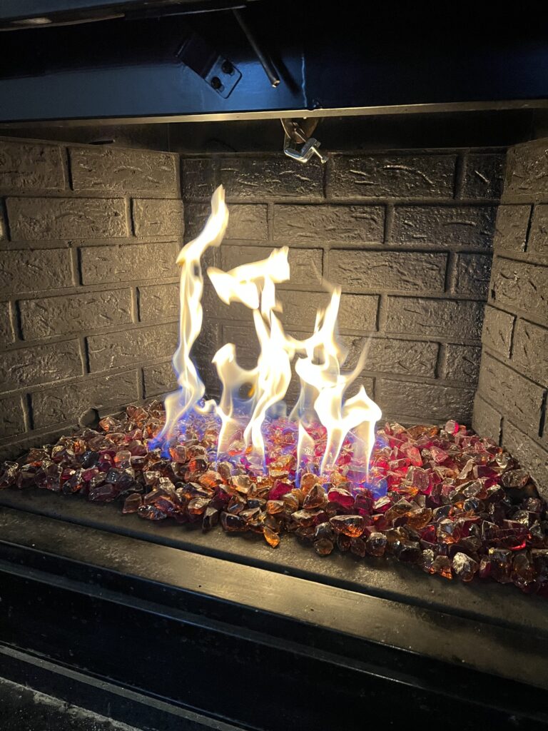 Gas fireplace installation with glass shards